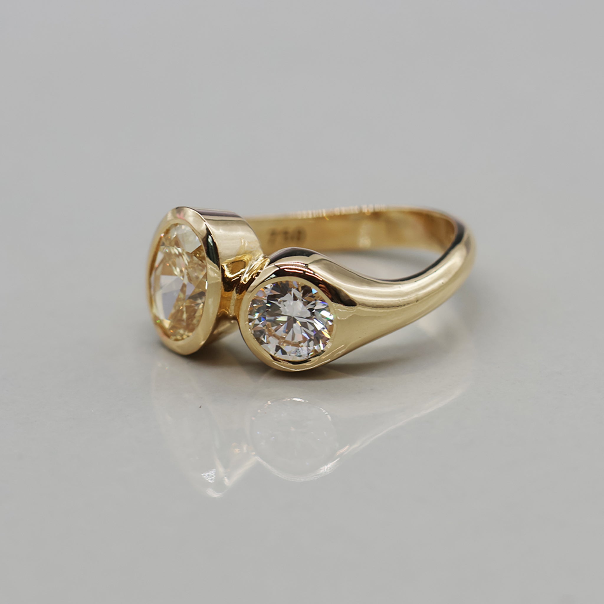 yellow gold two-stone toi et moi oval ring, angled view
